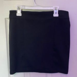 Cute black mini skirt with gold zipper detail